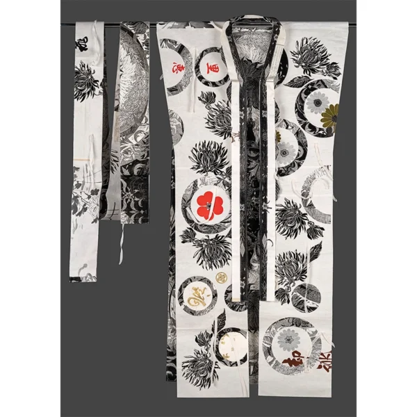 Christine Druitt-Preston: Wrapped, 2025 Stitched Washi and Wenzhou paper garment with obi on metal rail Image Size: 160x150x5cm. Photographer: Hi Res Digital Combining printmaking, stitching and found materials, this in artwork plays with the notion of a garment as a body wrapping. Salvaged Tatoushi, the stringed Washi paper used traditionally to wrap Kimonos has been appliqued with hand stitched Lino block print motifs, then cut and sewn into a form that references the Japanese wrapped-front, lined Kimono garment with Obi, or sash, it once held safe.
